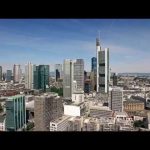 Scanclimber SC8000 mast climber cladding the 148 m Eurotower skyscraper in Frankfurt, Germany